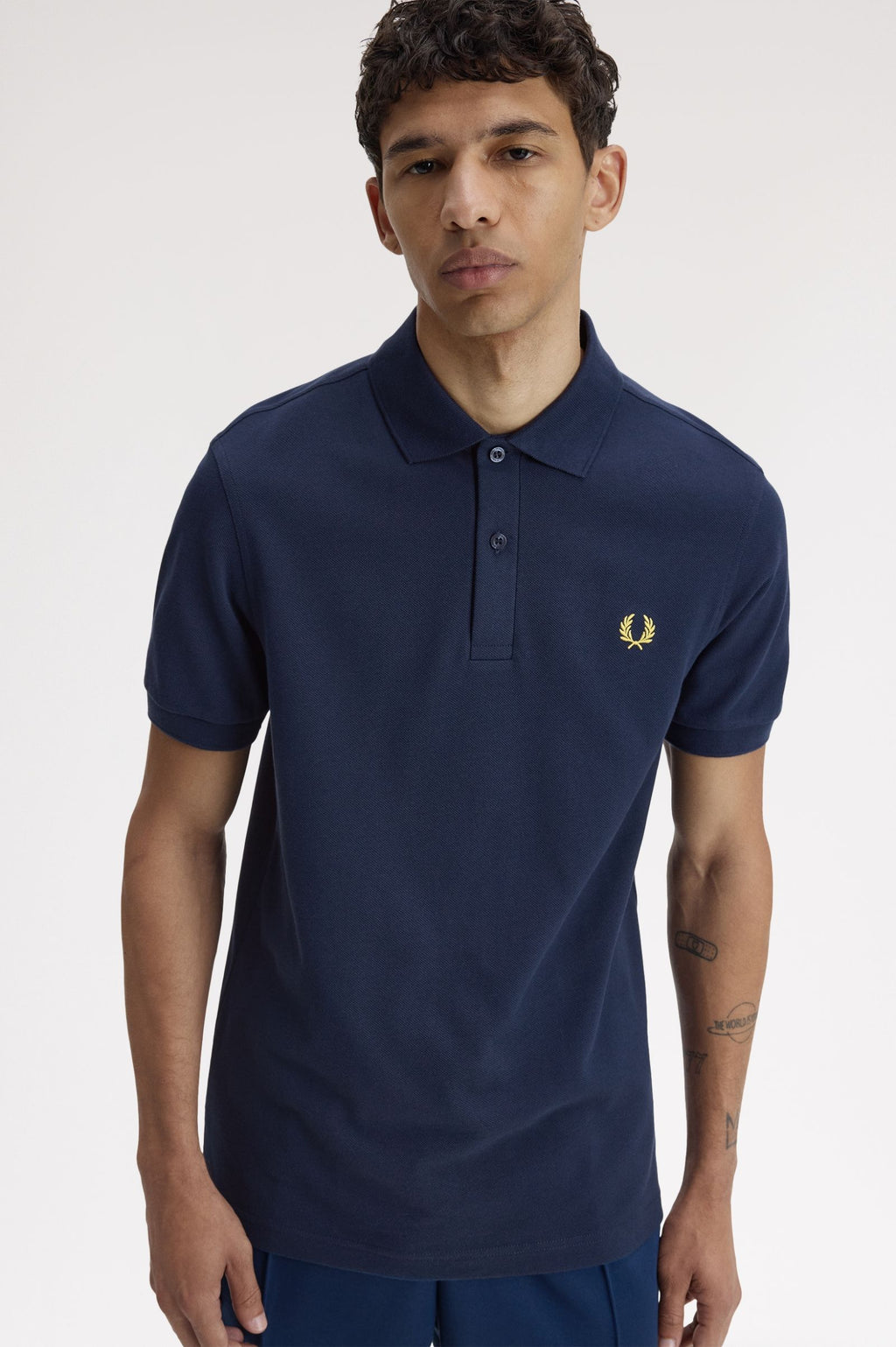 FRED PERRY (classic logo polo shirt) (Navy tee, gold logo)