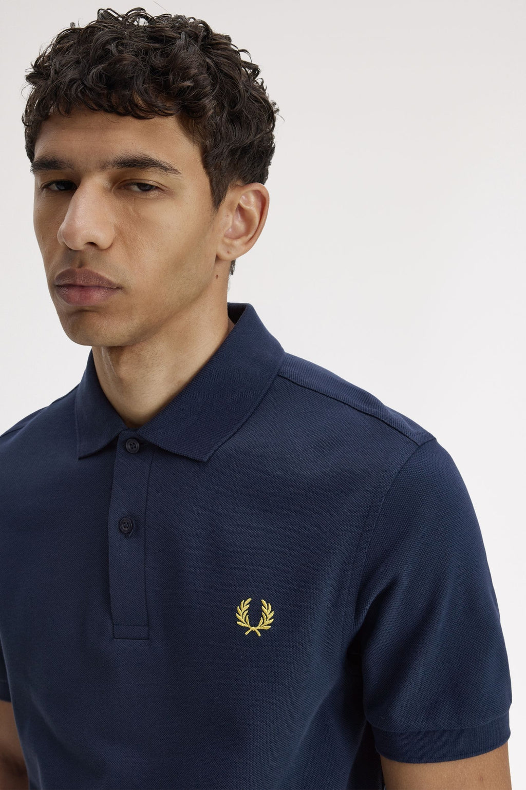 FRED PERRY (classic logo polo shirt) (Navy tee, gold logo)