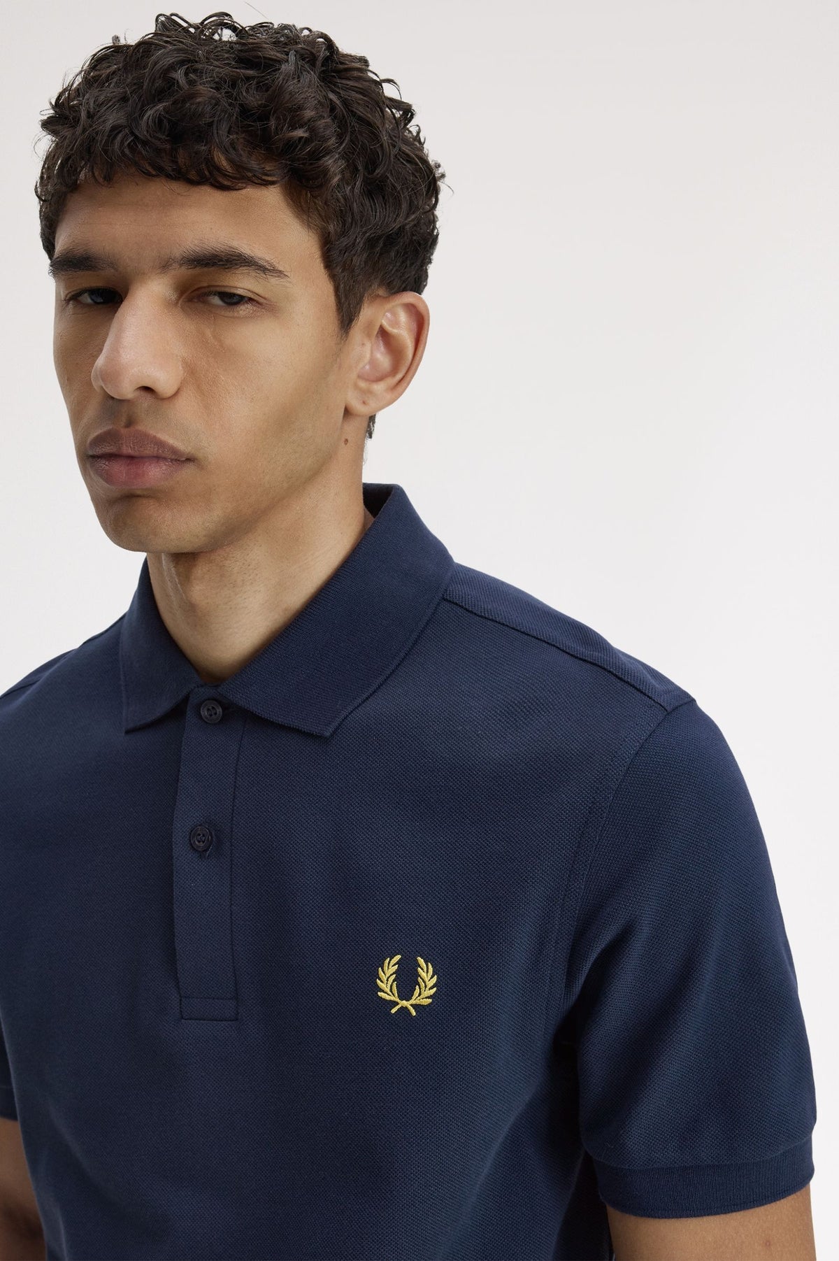 FRED PERRY (classic logo polo shirt) (Navy tee, gold logo)